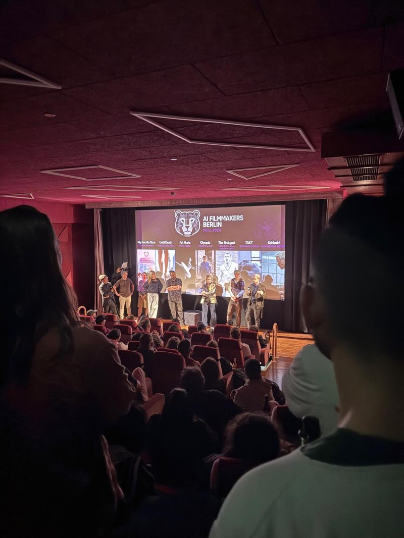 Filmmakers on stage in front of the Fall Session programme
