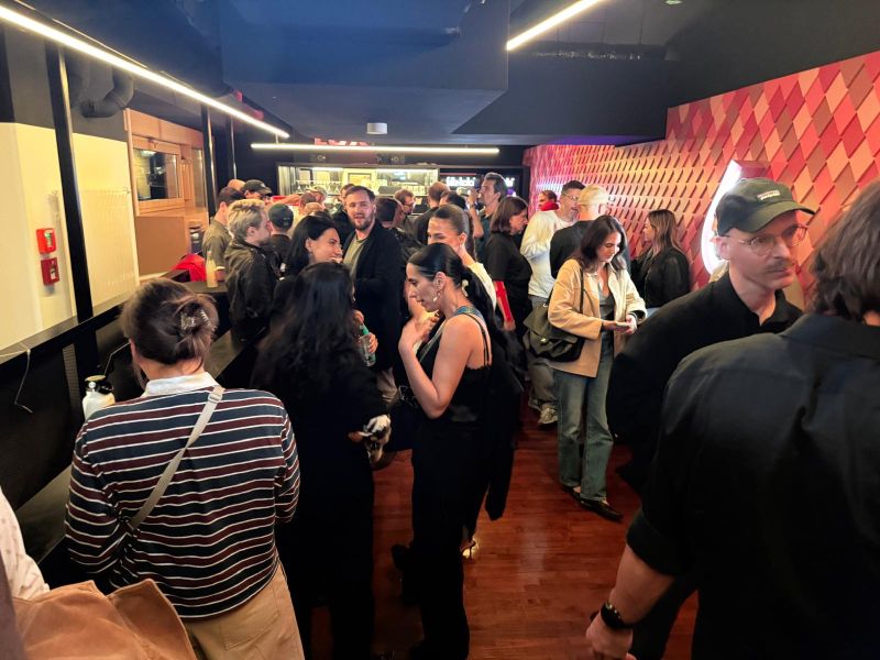 Guests talking in the Delphi LUX foyer after the screening