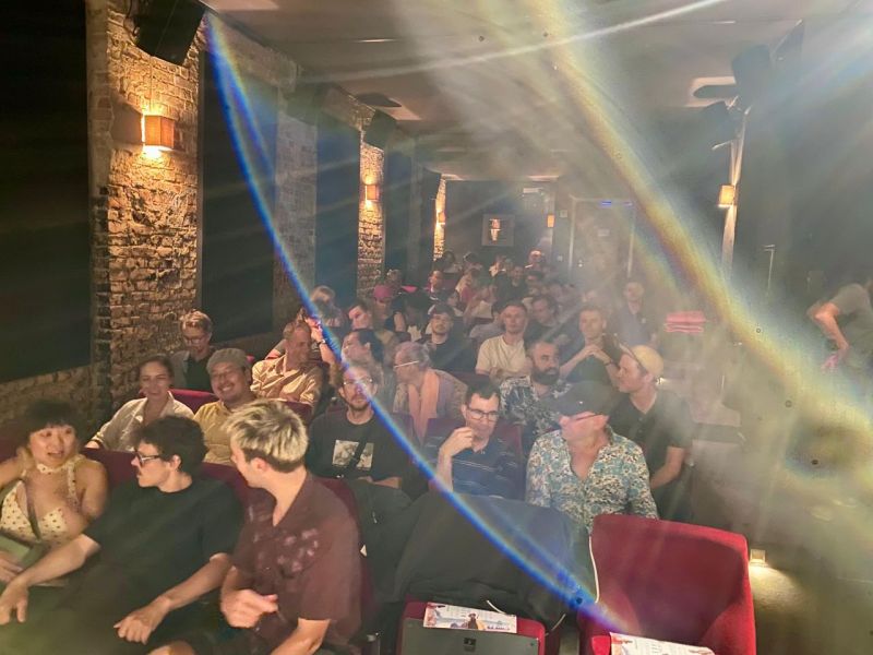 Audience in the cinema seats at IL KINO before the screening