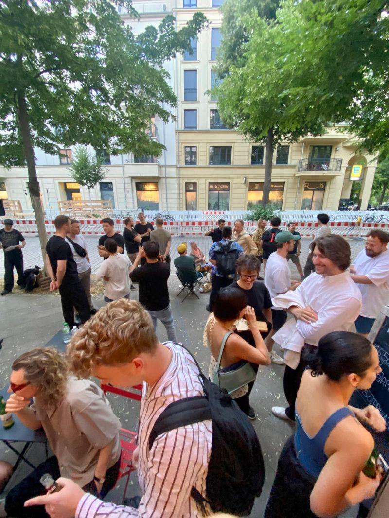 The crowd gathering on the street outside IL KINO