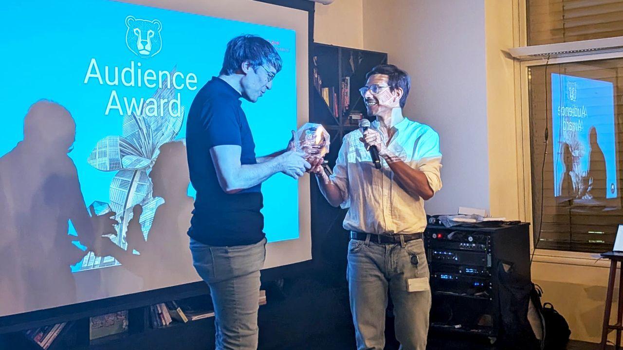Mark Wachholz receiving the first AI Filmmakers Berlin Audience Award
